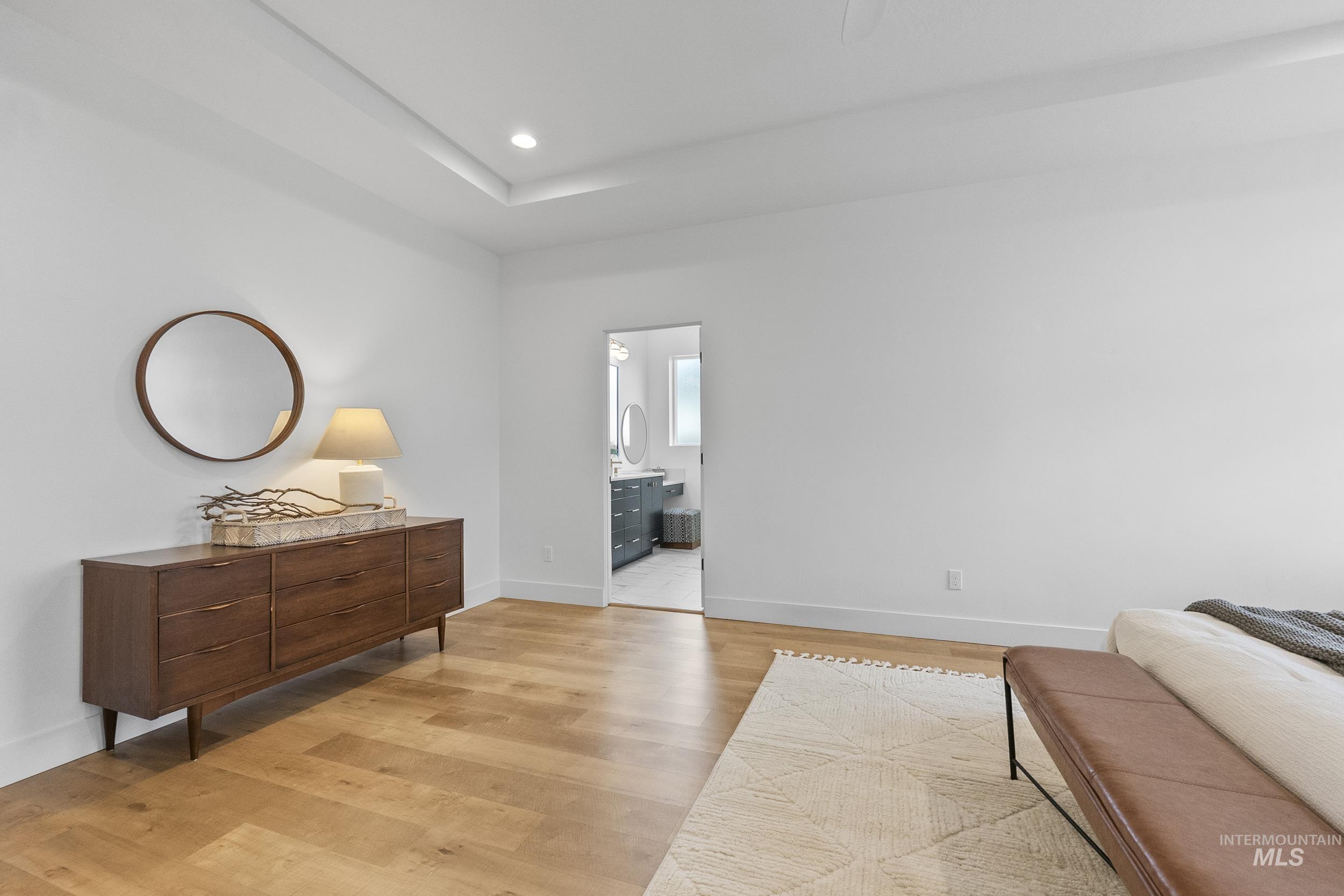 4320 South Selatir Way Meridian, ID 83642 - Photo 22 of 44 Sitting room featuring light wood-type flooring, recessed lighting, and a raised ceiling