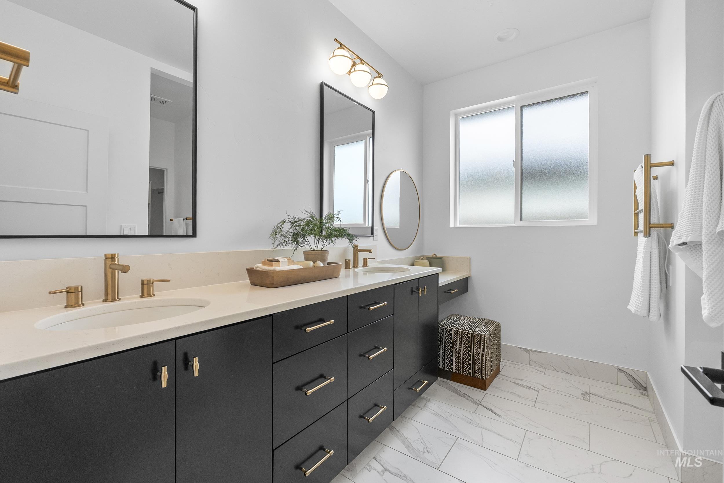 4320 South Selatir Way Meridian, ID 83642 - Photo 23 of 44 Bathroom featuring double vanity and light marble finish flooring