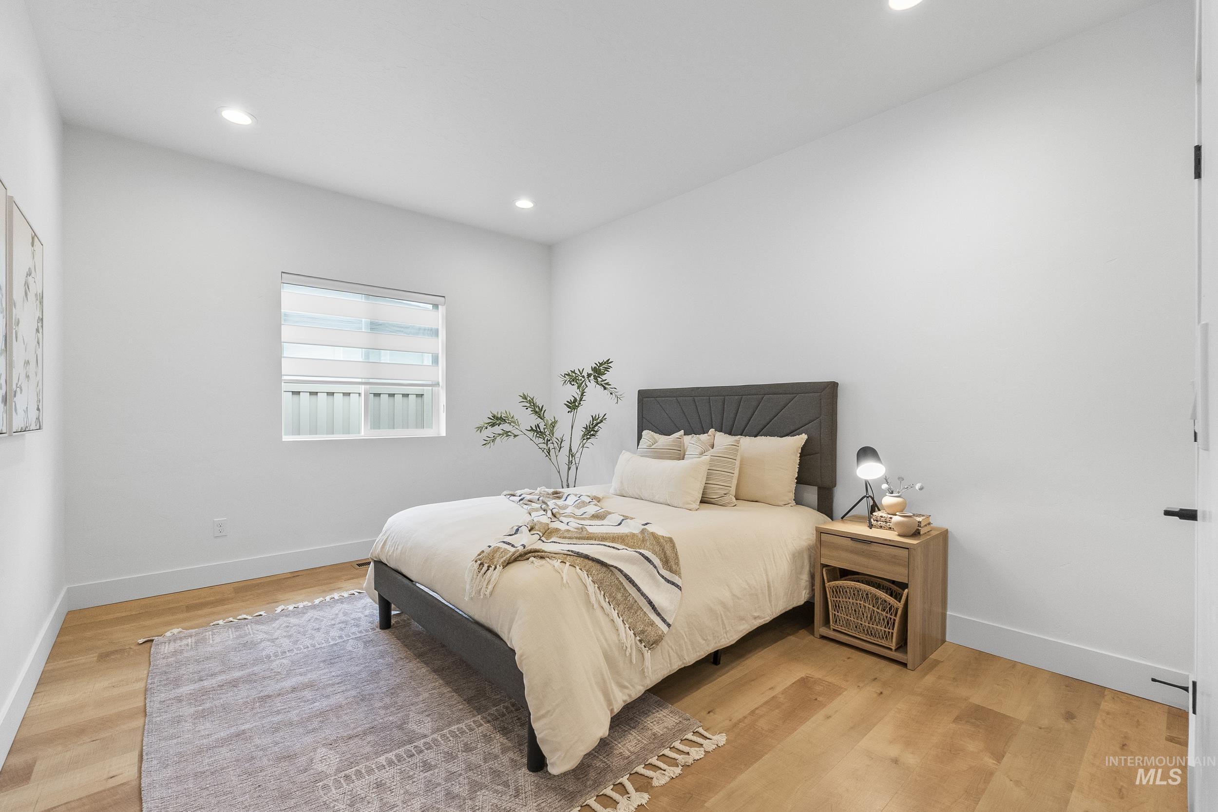 4320 South Selatir Way Meridian, ID 83642 - Photo 31 of 44 Bedroom featuring light wood-style floors and recessed lighting