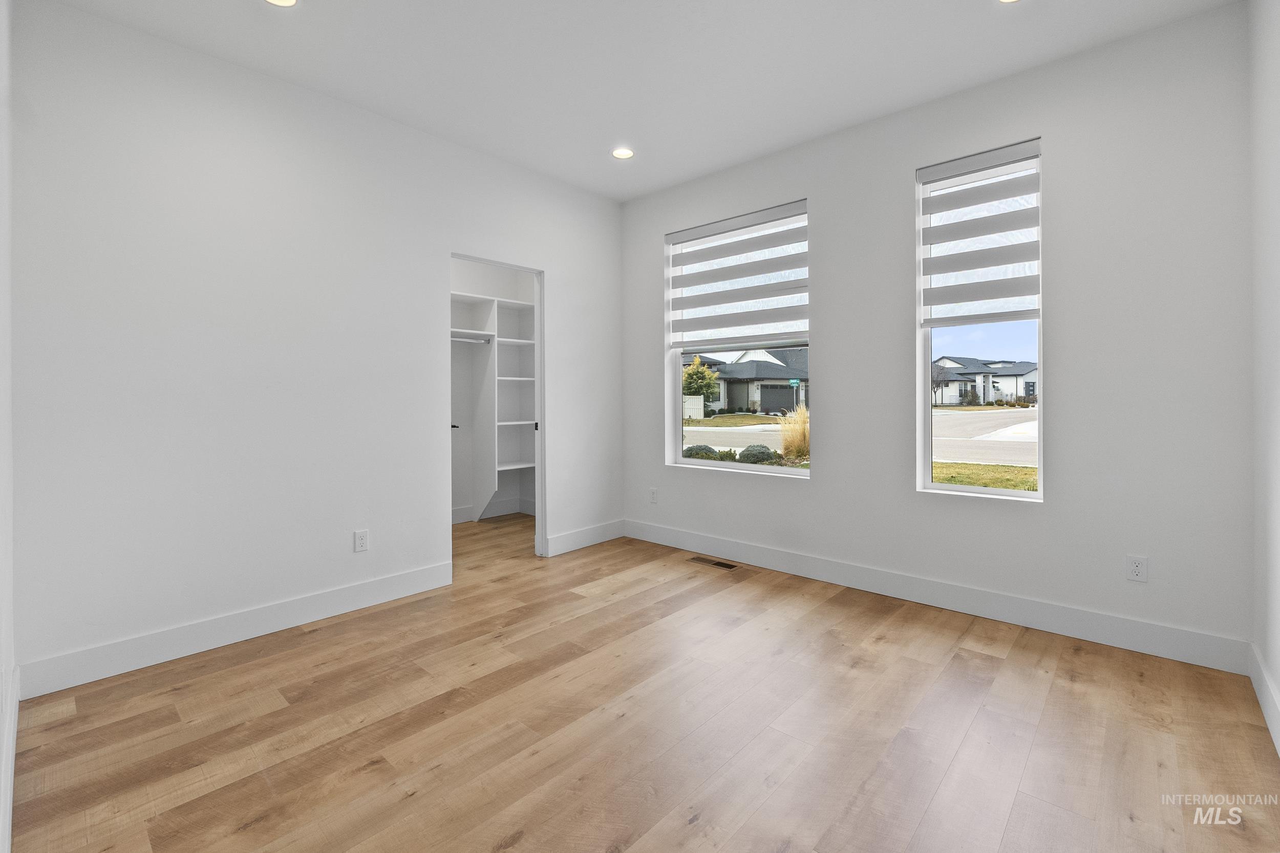 4320 South Selatir Way Meridian, ID 83642 - Photo 34 of 44 Unfurnished bedroom featuring a spacious closet, light wood-type flooring, and recessed lighting