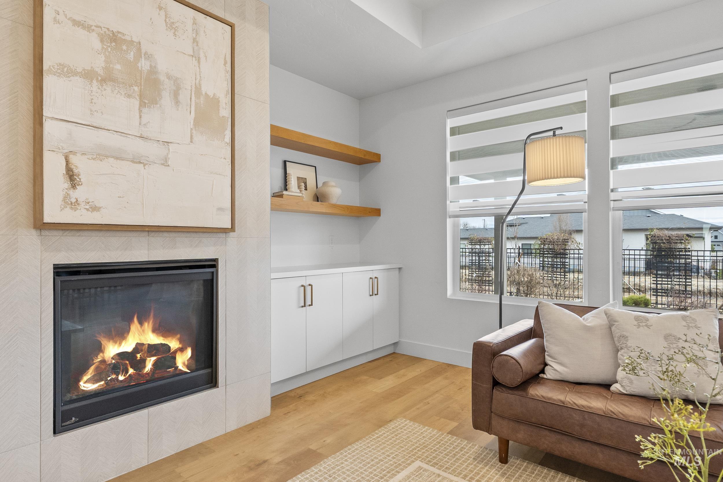 4320 South Selatir Way Meridian, ID 83642 - Photo 10 of 44 Sitting room with light wood-type flooring and a fireplace