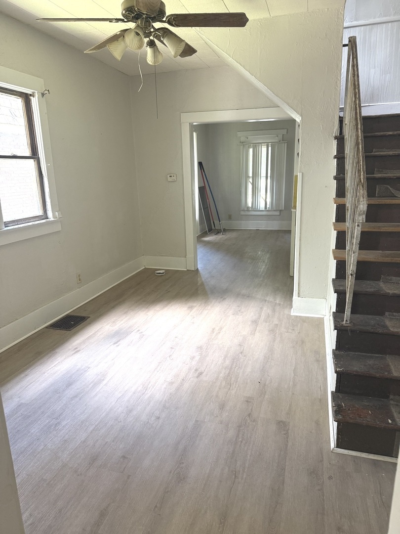 1850 East Prairie Avenue Decatur, IL 62521 - Photo 11 of 16 wooden floor in an empty room with a window