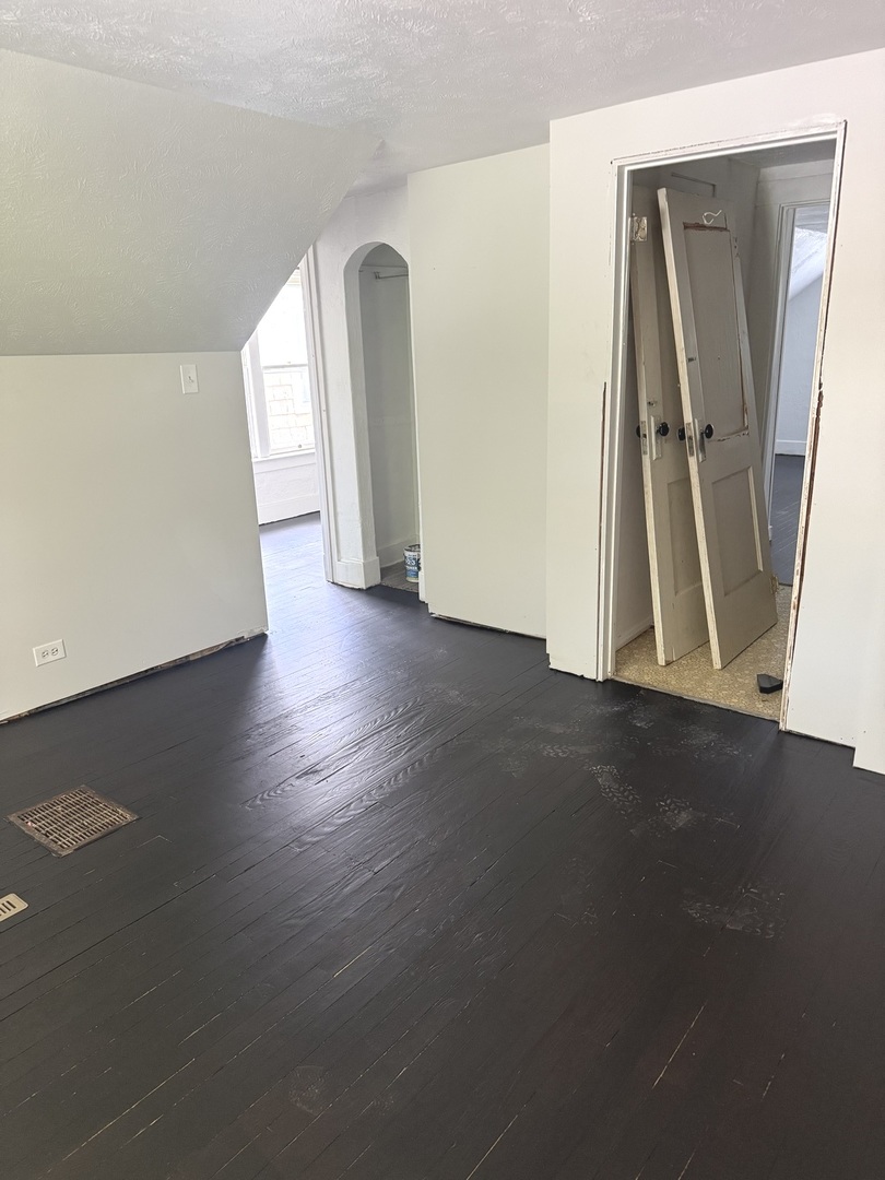 1850 East Prairie Avenue Decatur, IL 62521 - Photo 13 of 16 an empty room with wooden floor and windows