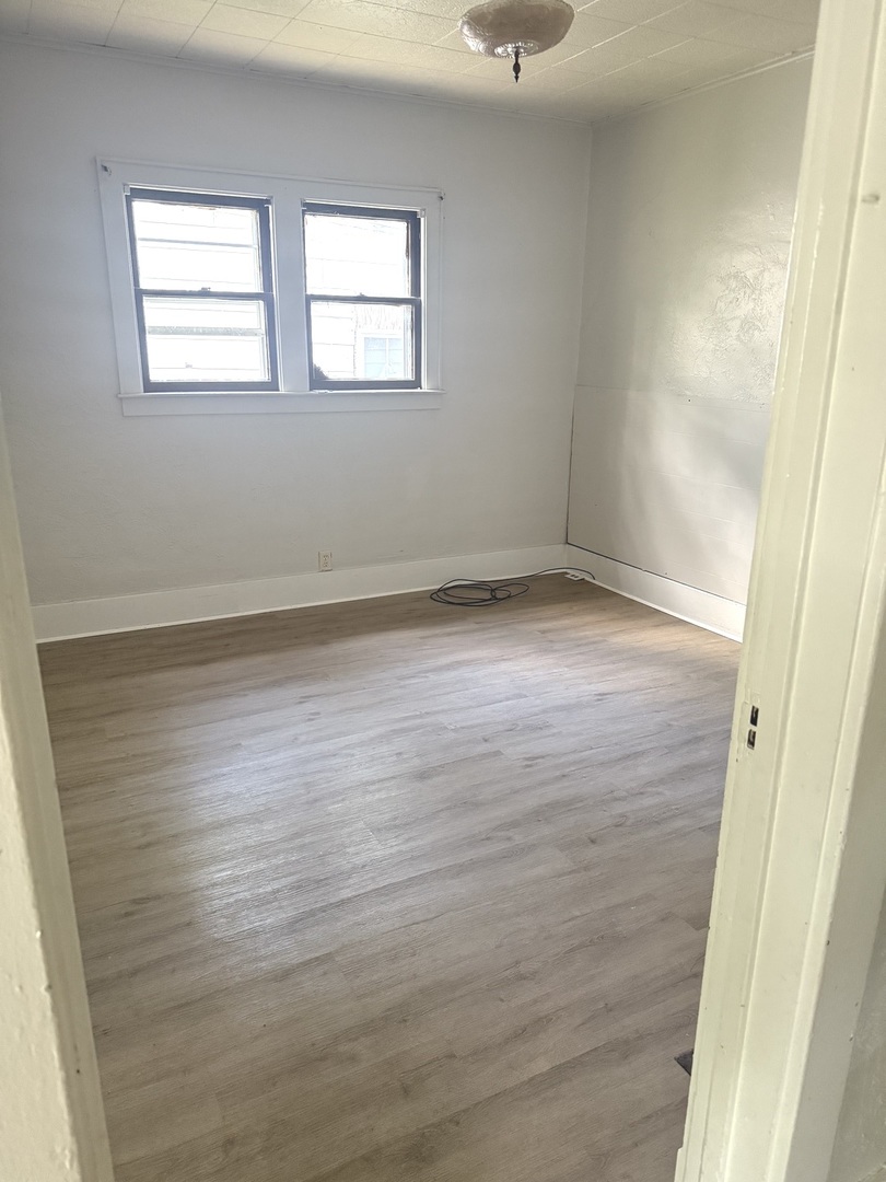 1850 East Prairie Avenue Decatur, IL 62521 - Photo 6 of 16 wooden floor in an empty room