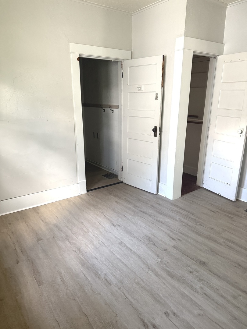 1850 East Prairie Avenue Decatur, IL 62521 - Photo 8 of 16 an empty room with wooden floor and entrance