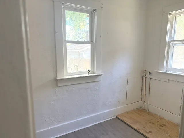 an empty room with windows