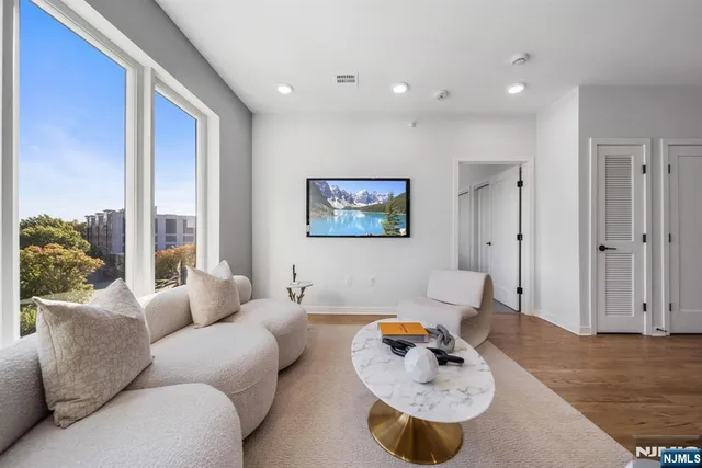 a living room with furniture and a table