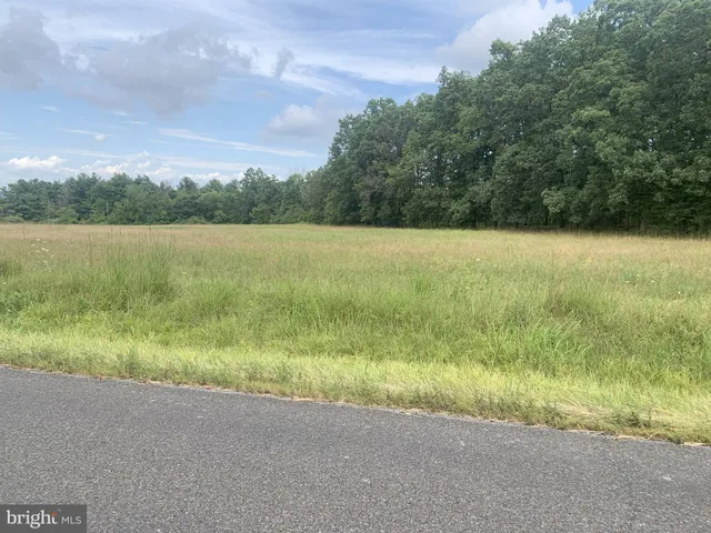 a view of a lake with a yard