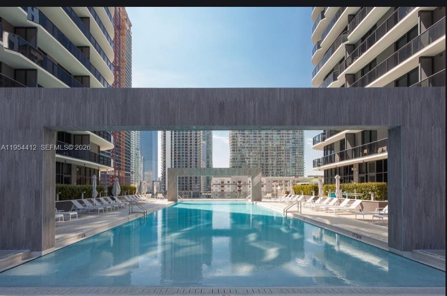 45 Southwest 9th Street, Unit 3910 Miami, FL 33130 - Photo 19 of 27 a view of swimming pool with outdoor seating