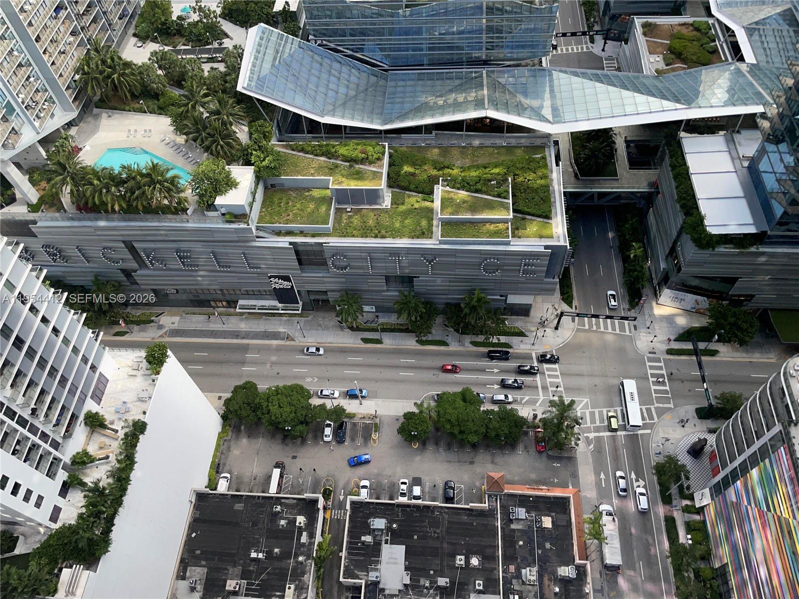 45 Southwest 9th Street, Unit 3910 Miami, FL 33130 - Photo 25 of 27 a view of a patio with chairs and potted plants