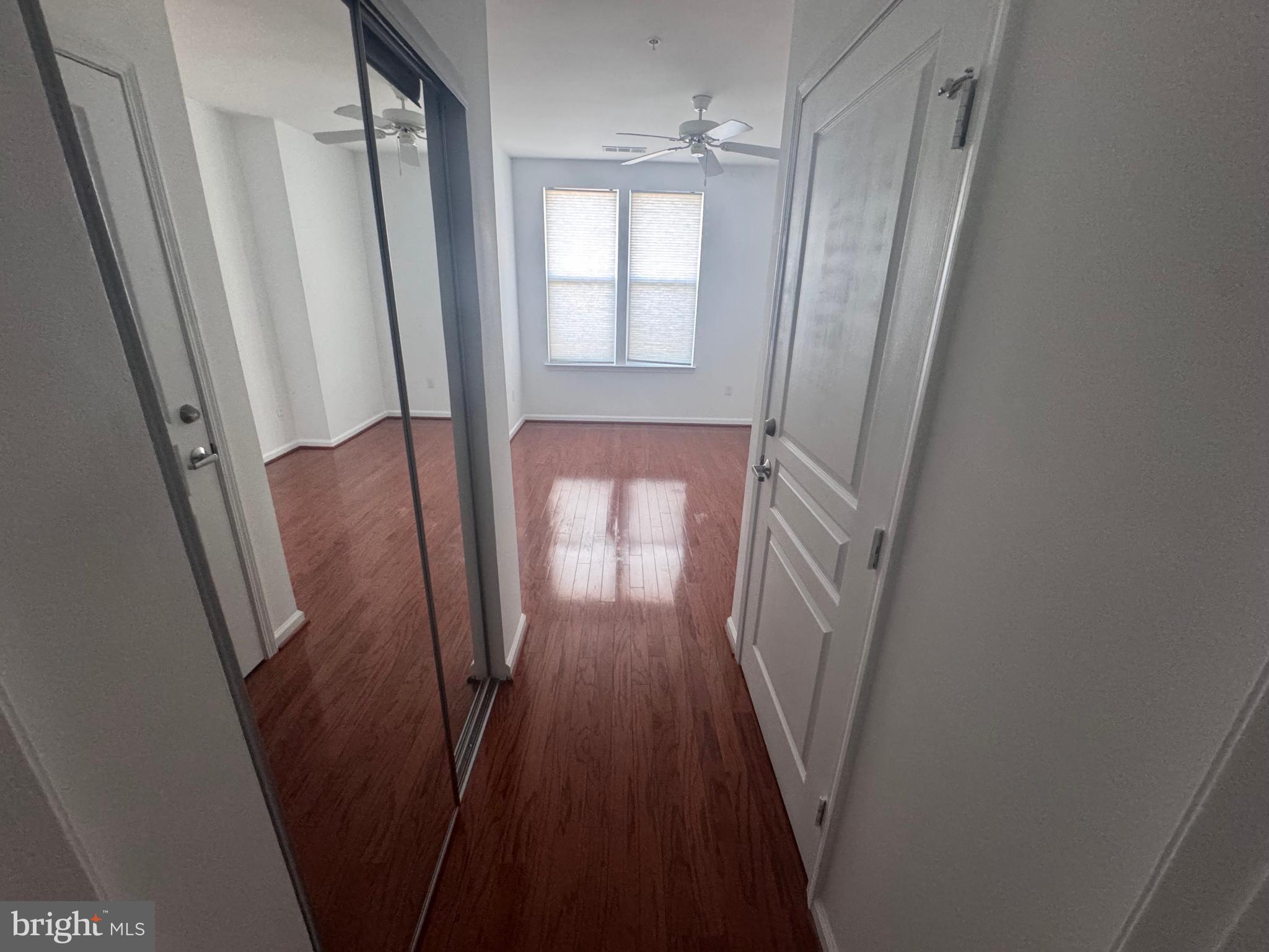 12000 Market Street, Unit 361 Reston, VA 20190 - Photo 32 of 49 a view of a hallway with wooden floor and stairs