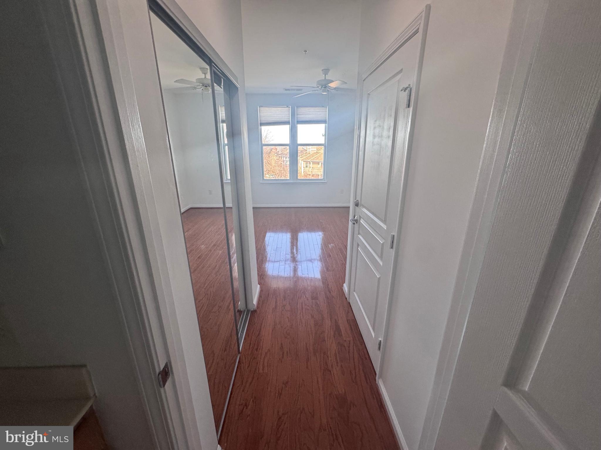 12000 Market Street, Unit 361 Reston, VA 20190 - Photo 35 of 49 a view of a hallway with wooden floor and staircase