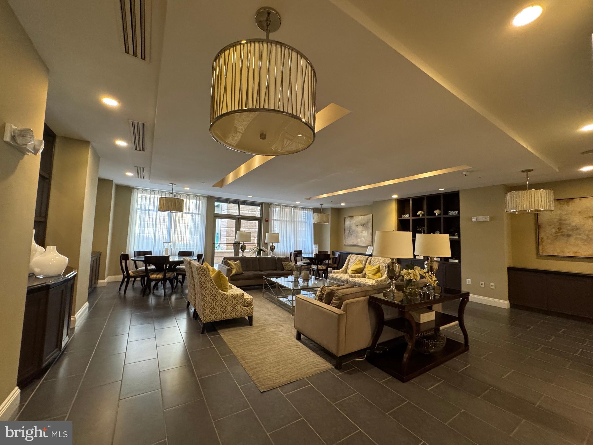 12000 Market Street, Unit 361 Reston, VA 20190 - Photo 43 of 49 a living room with furniture