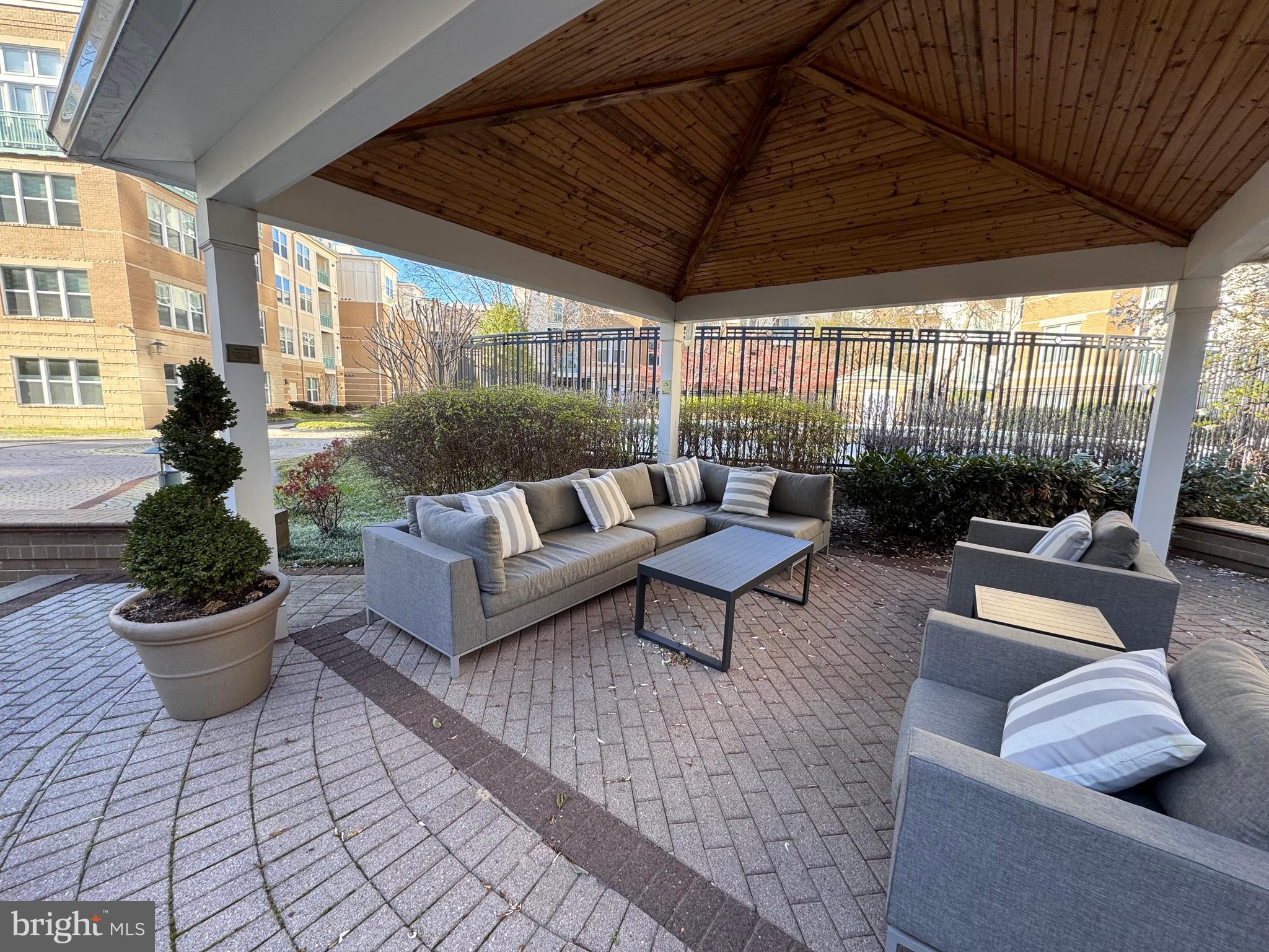 12000 Market Street, Unit 361 Reston, VA 20190 - Photo 47 of 49 a outdoor living space with furniture and a potted plant