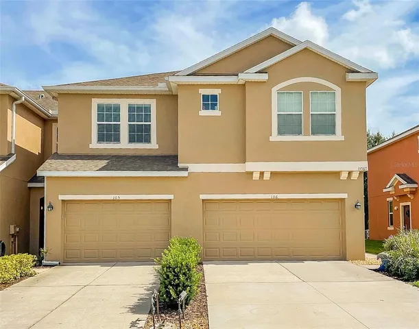 a front view of a house with a garage