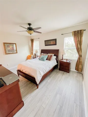 a bedroom with a bed and window