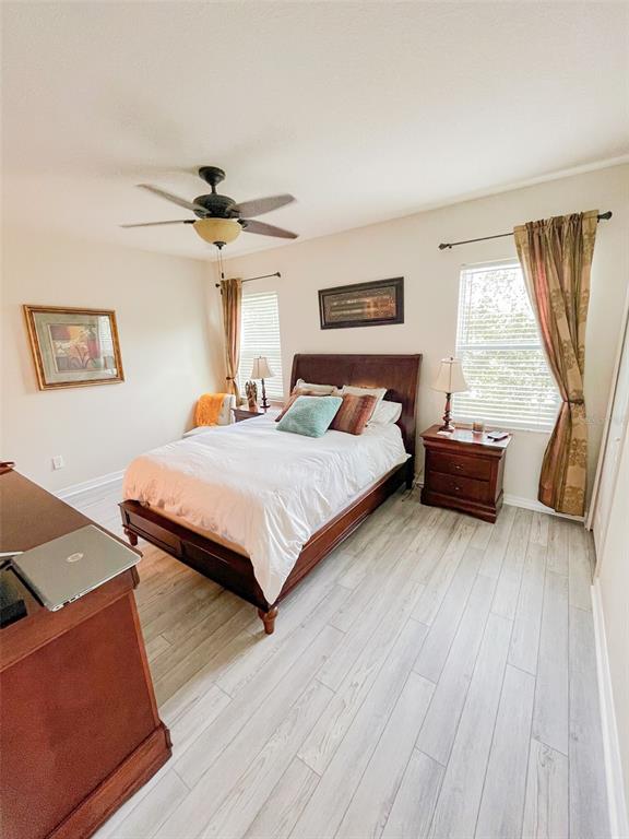 11567 84th St Circle East, Unit 105 Parrish, FL 34219 - Photo 12 of 18 a bedroom with a bed and window