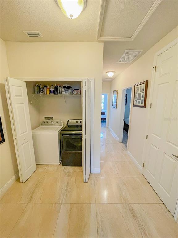 11567 84th St Circle East, Unit 105 Parrish, FL 34219 - Photo 15 of 18 a view of a storage & utility room with a sink