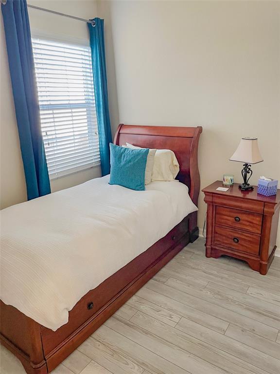 11567 84th St Circle East, Unit 105 Parrish, FL 34219 - Photo 16 of 18 a bedroom with a bed and a window