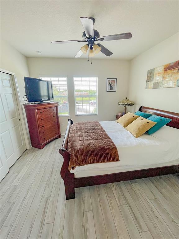 11567 84th St Circle East, Unit 105 Parrish, FL 34219 - Photo 18 of 18 a bedroom with a bed and window