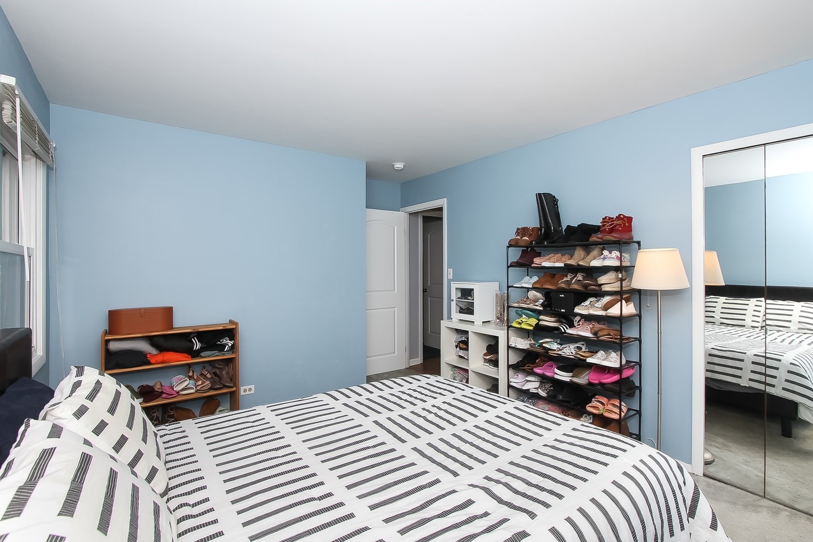 993 Bernard Drive Buffalo Grove, IL 60089 - Photo 12 of 29 a bedroom with a bed and a closet