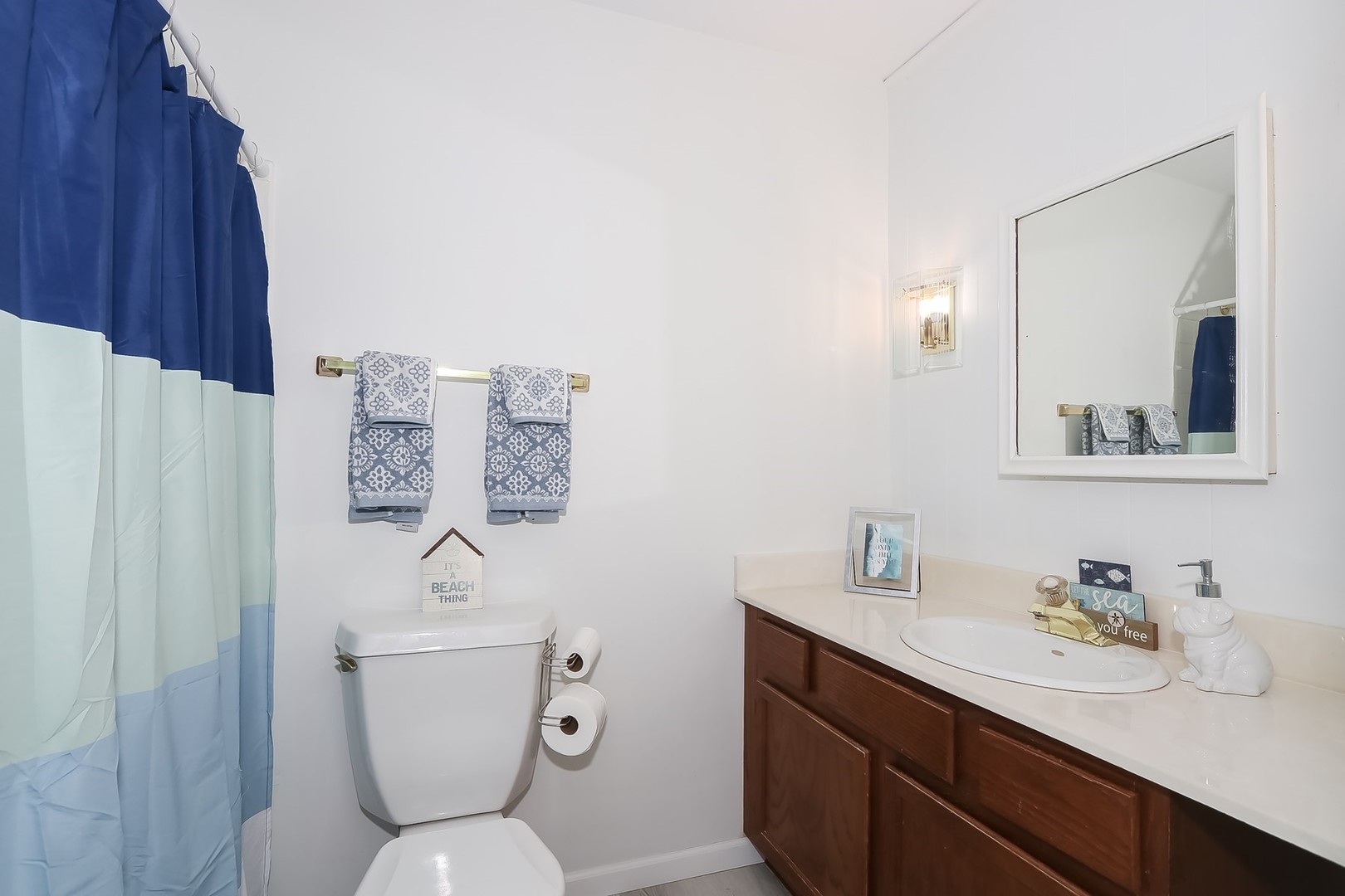 993 Bernard Drive Buffalo Grove, IL 60089 - Photo 14 of 29 a bathroom with a toilet sink and mirror