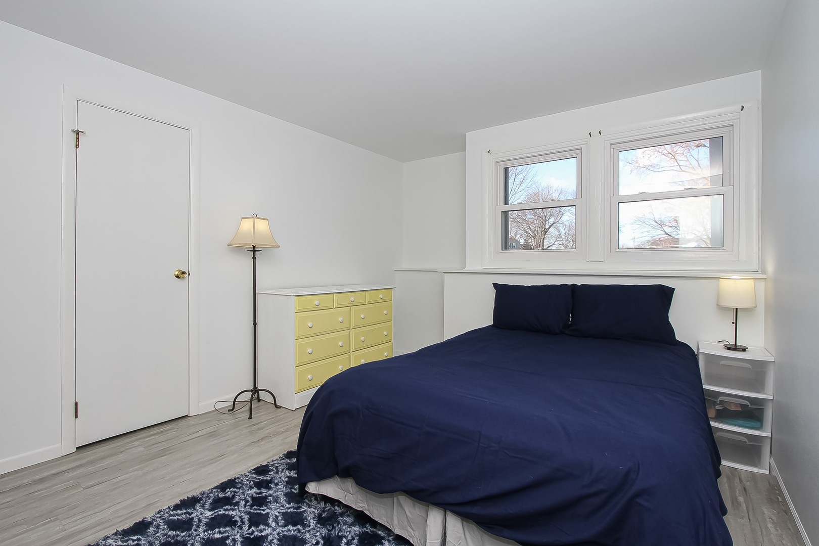 993 Bernard Drive Buffalo Grove, IL 60089 - Photo 16 of 29 a bedroom with a bed and window