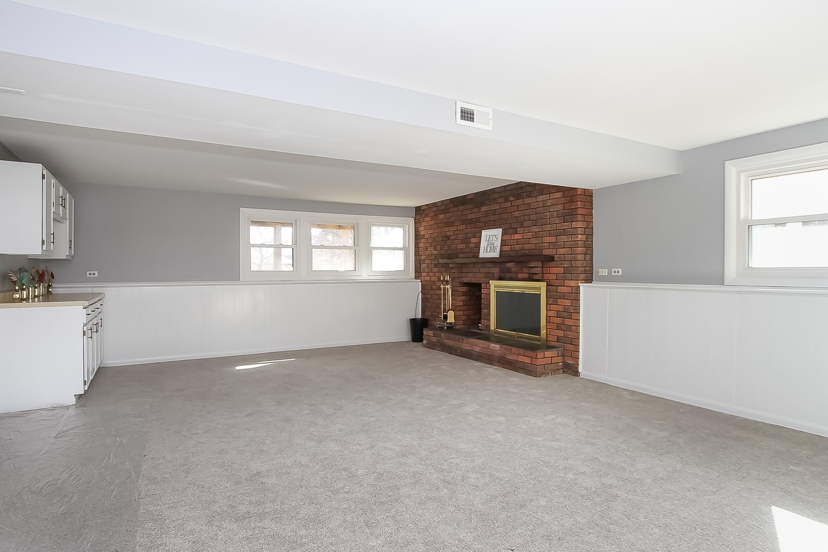 993 Bernard Drive Buffalo Grove, IL 60089 - Photo 20 of 29 a view of empty room with a fireplace and window