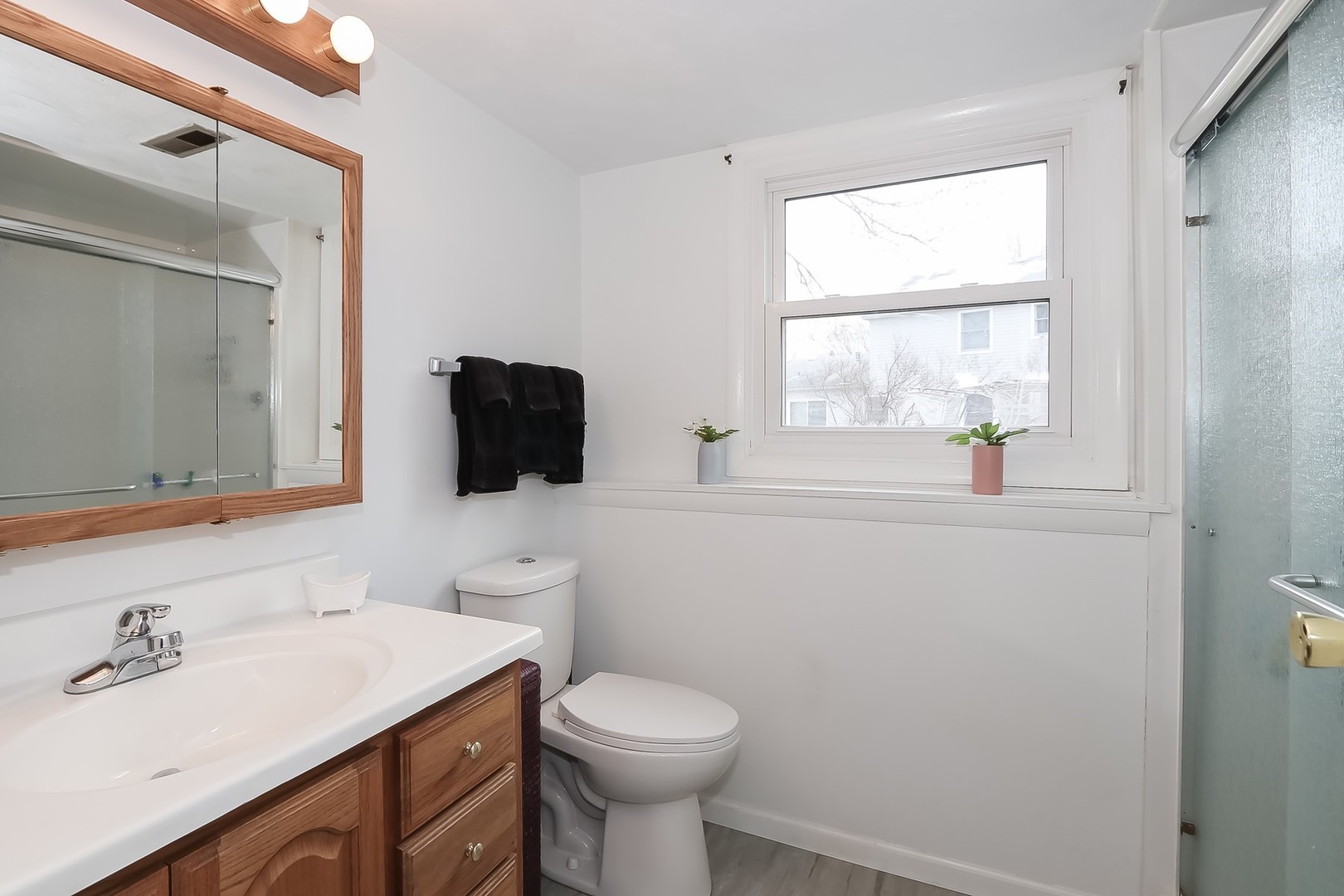 993 Bernard Drive Buffalo Grove, IL 60089 - Photo 23 of 29 a bathroom with a sink toilet and mirror