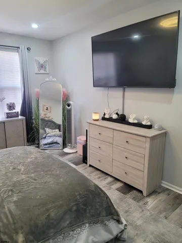 a spacious bathroom with a double vanity sink and a mirror
