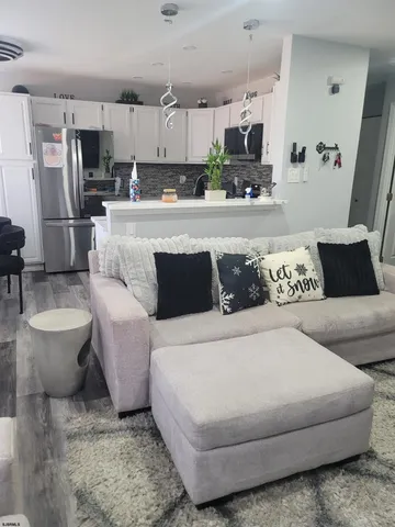 a large bedroom with a bed and couch