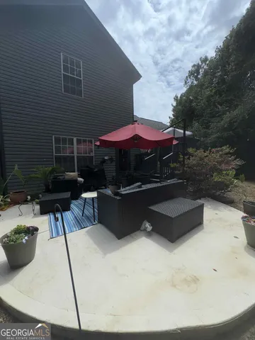 a view of backyard with seating space