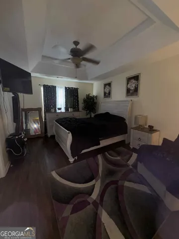 a bed room with a bed and a tv