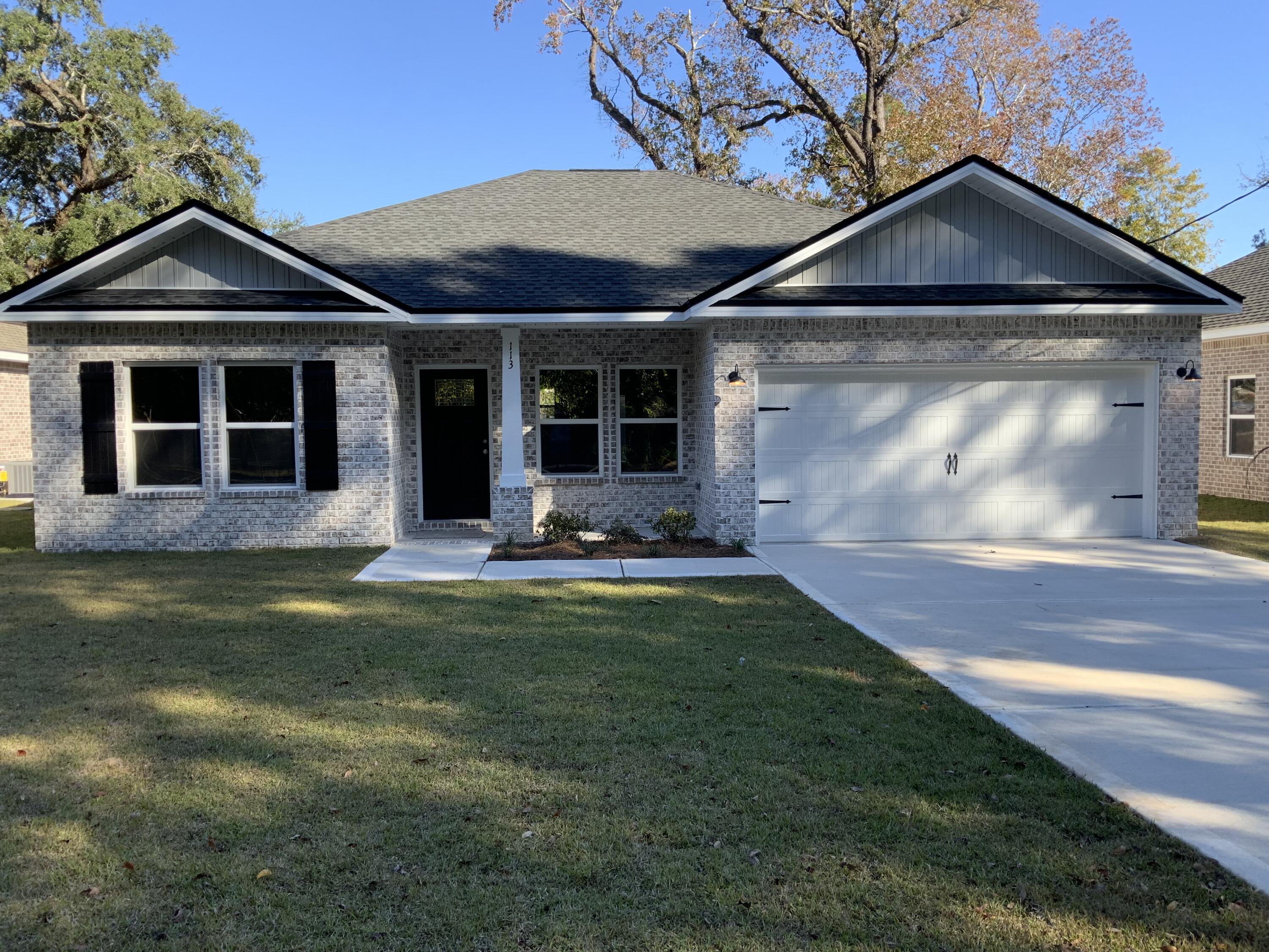 113 Shady Lane Crestview, FL 32536 - Photo 1 of 8 a view of a house with garden