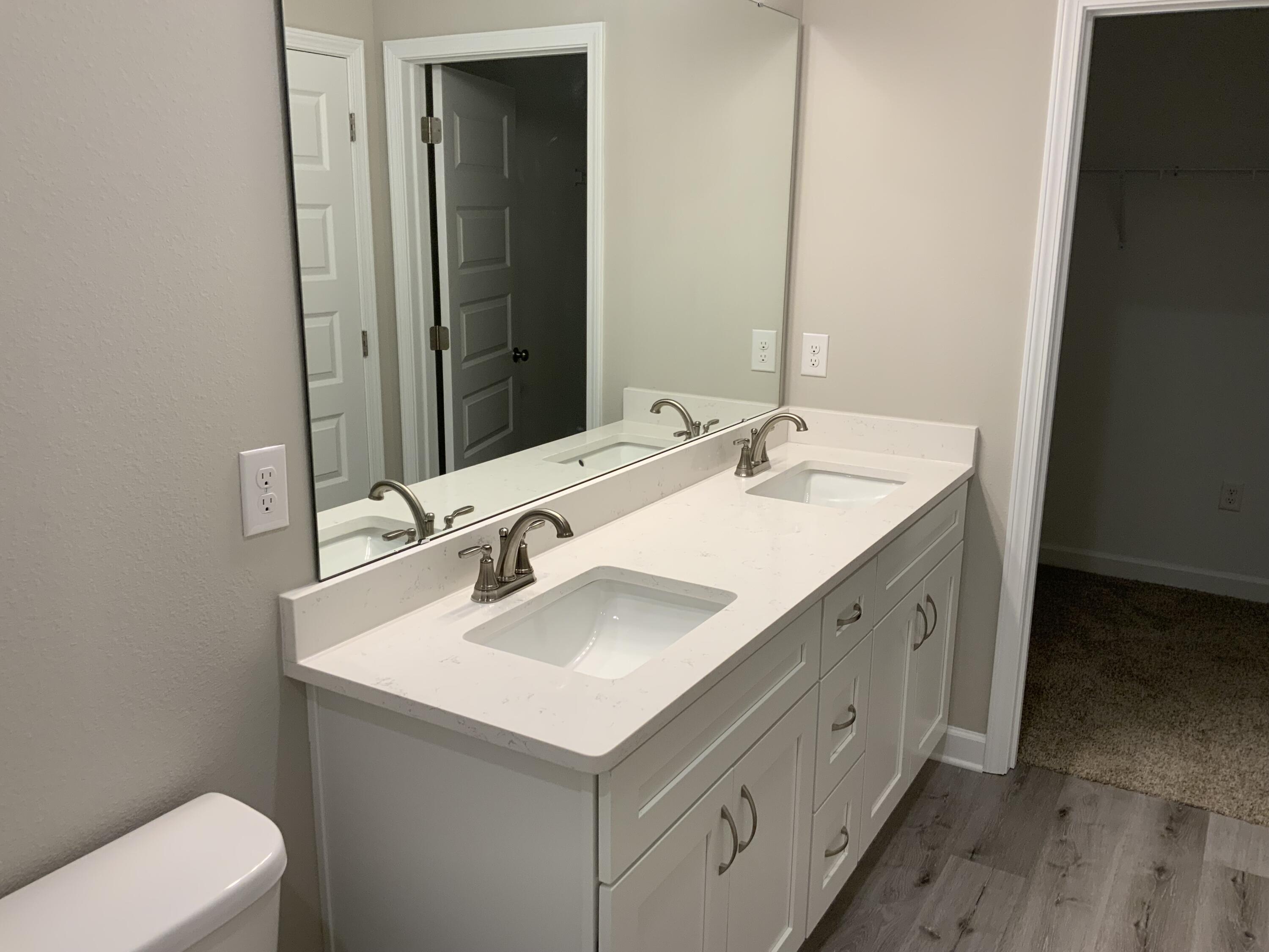 113 Shady Lane Crestview, FL 32536 - Photo 5 of 8 a bathroom with a sink and a mirror
