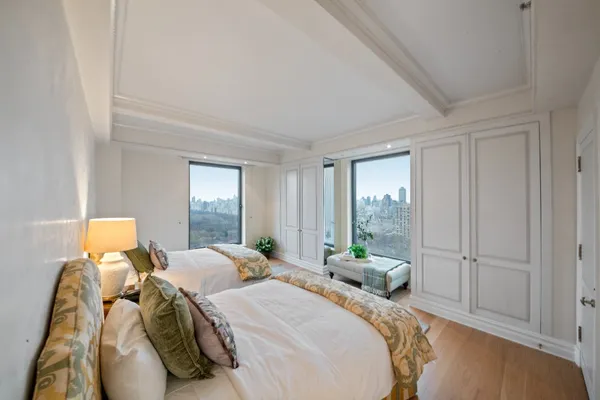 a bed room with a bed and a window