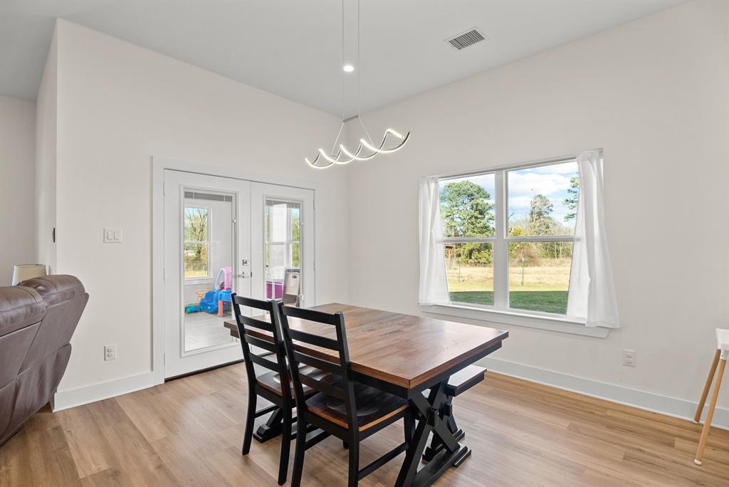 12754 Ridgeway Court Winona, TX 75792 - Photo 13 of 38 a view of a dining room with furniture and wooden floor