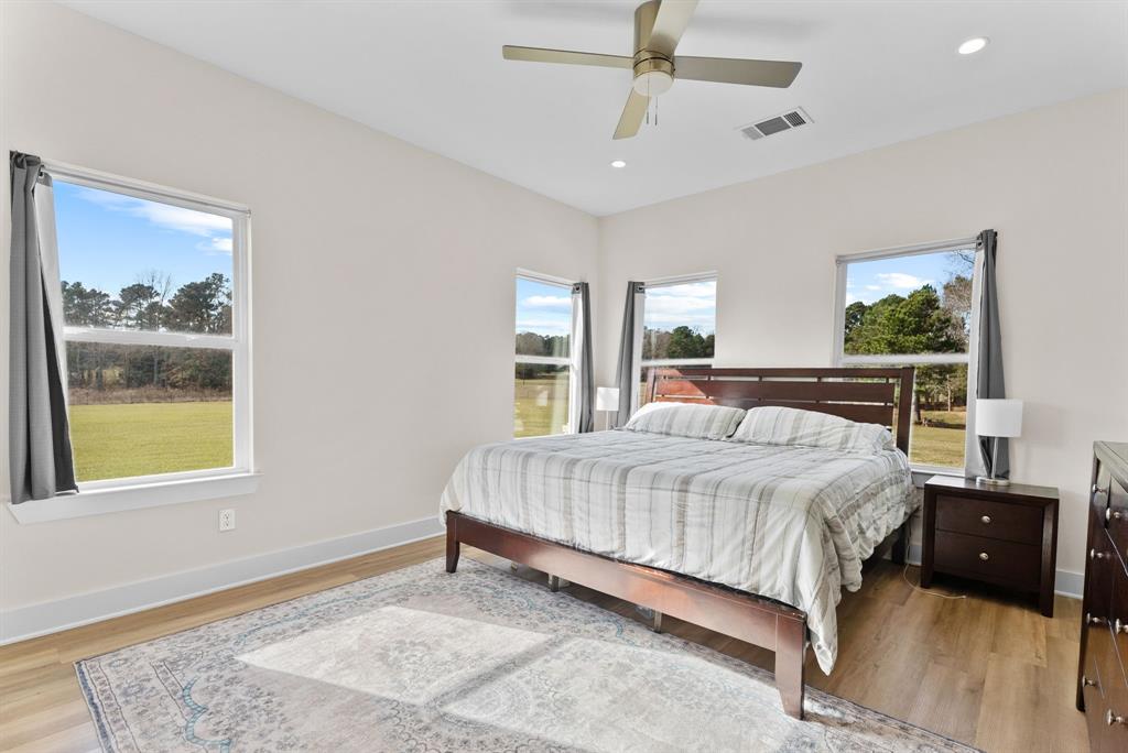 12754 Ridgeway Court Winona, TX 75792 - Photo 16 of 38 a bedroom with a bed and a window