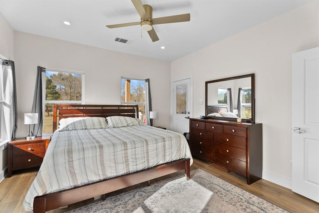 12754 Ridgeway Court Winona, TX 75792 - Photo 17 of 38 a bedroom with a bed and a dresser