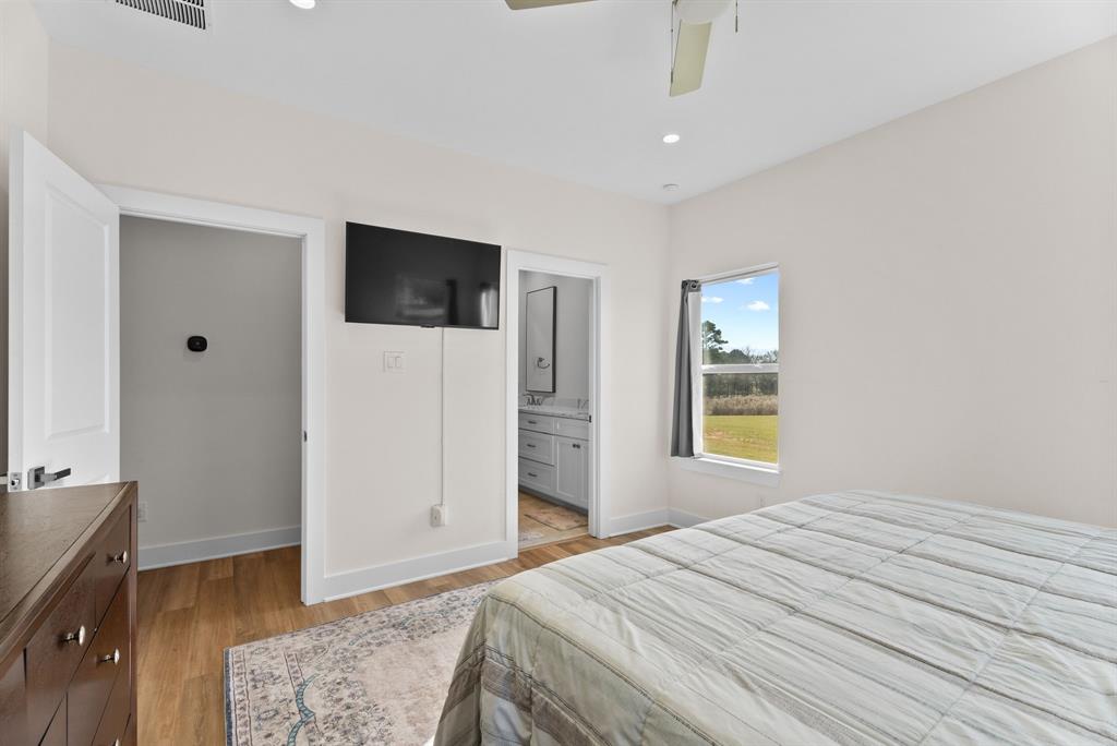 12754 Ridgeway Court Winona, TX 75792 - Photo 18 of 38 a bedroom with a bed and a television