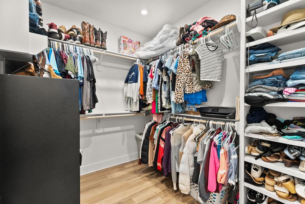 12754 Ridgeway Court Winona, TX 75792 - Photo 21 of 38 a view of walk in closet with clothes and shoes