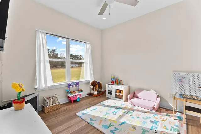 a bedroom with furniture and a window