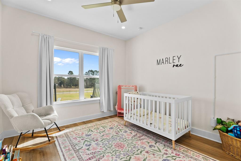 12754 Ridgeway Court Winona, TX 75792 - Photo 26 of 38 a view of a room with wooden floor and a window