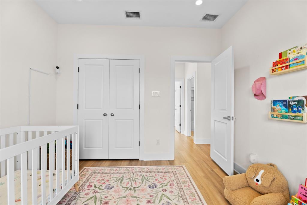 12754 Ridgeway Court Winona, TX 75792 - Photo 27 of 38 a bedroom with furniture and a wooden floor