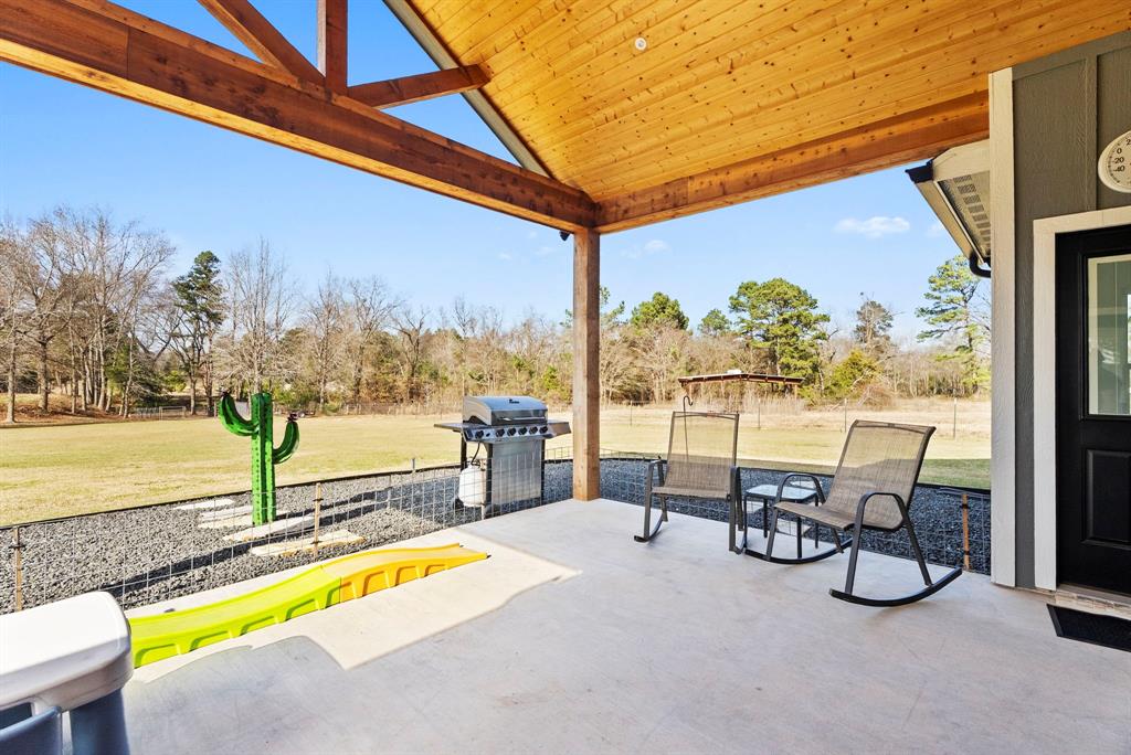12754 Ridgeway Court Winona, TX 75792 - Photo 3 of 38 a view of a swimming pool with a table and chairs