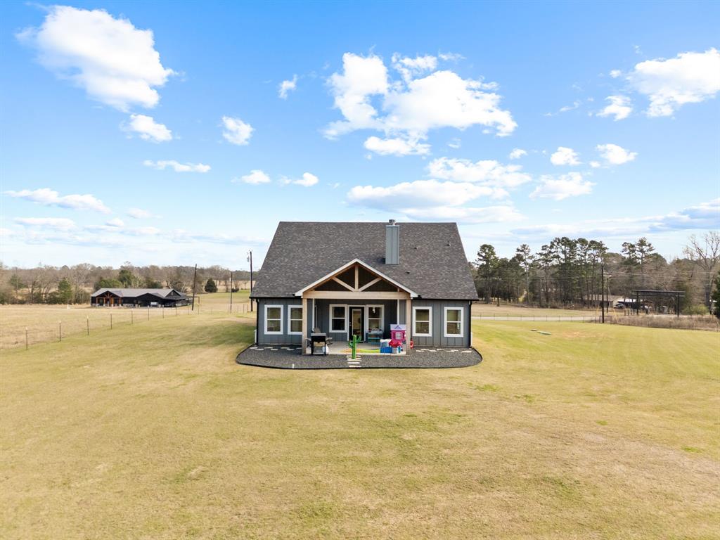 12754 Ridgeway Court Winona, TX 75792 - Photo 34 of 38 a tall buildings with swimming pool in front of it
