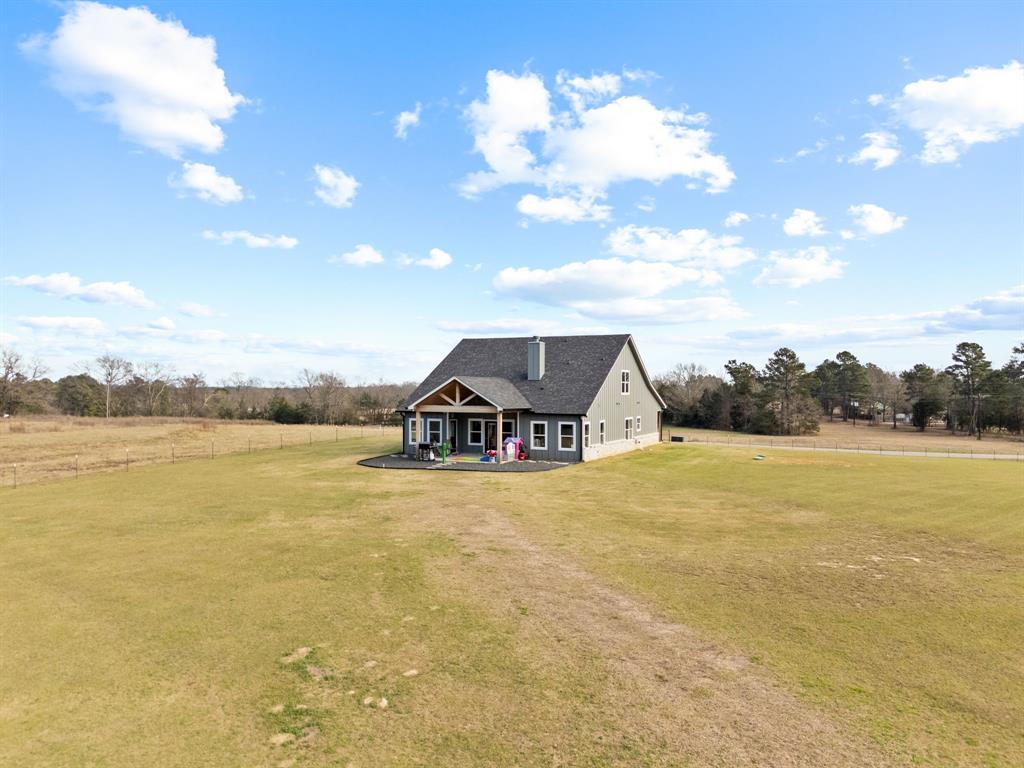 12754 Ridgeway Court Winona, TX 75792 - Photo 35 of 38 a view of house with yard and ocean view
