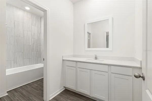 a bathroom with a bathtub and a sink
