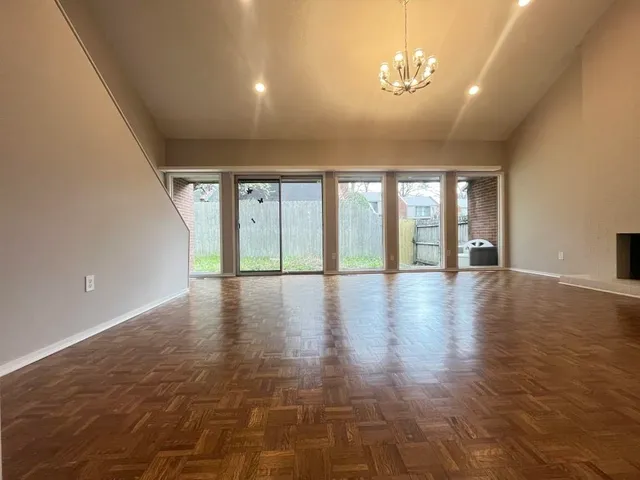 a view of an entryway with wooden floor