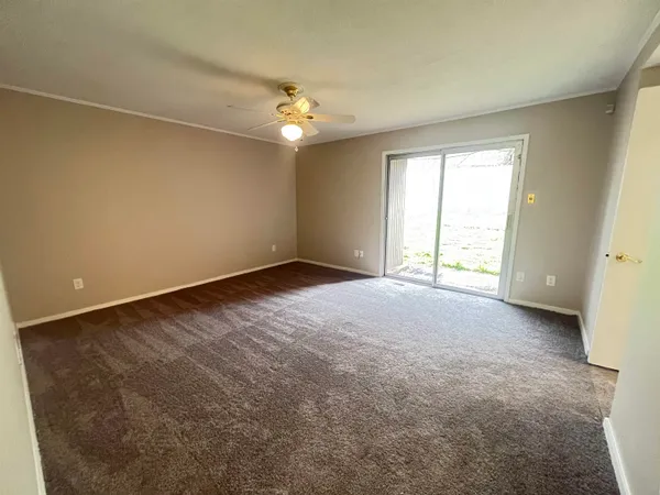 an empty room with a empty space and a window